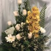 Lovely arrangement with white roses, yellow cymbidium orchids, accented with white gerbera