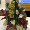 Grand and full of impact!  This beautiful arrangement with Cymbidium, Antherium