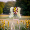 A heartfelt floral tribute in the shape of angel wings, symbolizing peace