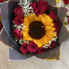 1 sunflower in the middle of a dozen(12) roses (color of roses