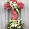 This stunning cross is made with radiant dahlias, pure white lilies, dainty