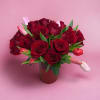 A vase full of red roses and tulips for your house or