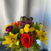 Bright and bold long lasting flowers in a clear vase.
