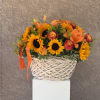 Overflowing with golden hues and joyful blooms, Basket Full of Sunshine features