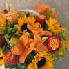 Overflowing with golden hues and joyful blooms, Basket Full of Sunshine features