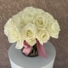 Elegant and heartfelt, Cream Whisper features soft ivory roses hand-tied with a