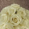 Elegant and heartfelt, Cream Whisper features soft ivory roses hand-tied with a
