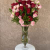 Graceful and grand, Forever Yours features an elevated bouquet of rich red
