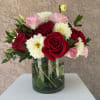 Soft and romantic with a bold twist, Love Notes blends red roses
