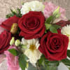 Soft and romantic with a bold twist, Love Notes blends red roses