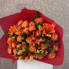 Bursting with bold personality, Tangerine Flame features a vibrant hand-tied mix of