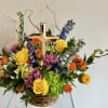 A beautifully bright floor basket is captured in this stunning arrangement with
