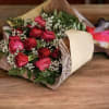 This bouquet is a romantic and classic hand-tied arrangement, with deep red