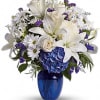 Beautiful blooms such as blue hydrangea, cr&egrave;me roses, white lilies and alstroemeria