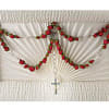 A sacred rosary handcrafted from red rosebuds, symbolizing undying love, faith, and