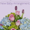 Celebrate the new bundle of joy with a flower arrangement chosen and