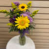 Small mixed cut arrangement with sunflowers, lavender cushions, purple alstroemeria, and yellow