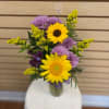 Small mixed cut arrangement with sunflowers, lavender cushions, purple alstroemeria, and yellow