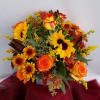 This Fall arrangement is filled with a cluster of eye catching bi-colored