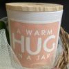 This basket of lush florals and a candle is a great gift