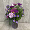 Send this petite lovely lavender themed arrangement today! Flowers and colors may
