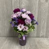Send this petite lovely lavender themed arrangement today! Flowers and colors may