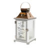 This decorative keepsake lantern reads &quot;Because someone we love is in Heaven