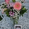 Pink roses, gerberas, calla lilies, purple daisies, lavender cushion poms, baby&#039;s breath