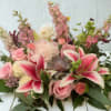  A romantic fusion of soft pinks, creamy whites, and lush greens