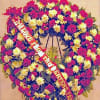 This compact, yet flower-filled wreath is perfect for any religious ceremony. Standing