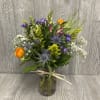 Unique wildflower arrangement designed to look like the flowers were fresh picked