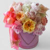 Roses of mixed shades and styles of pinks lavenders and blush arranged