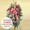 This classic standing spray, filled with bright daisies and tulips, is a