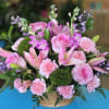 A delicate and harmonious floral arrangement in soft pink and lilac tones