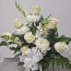 One sided vase to enjoy anywhere.  All white flowers including roses.