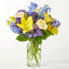 Refreshing and vibrant, this zesty floral arrangement is expertly arranged to create