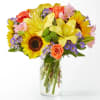 Feel the warmth with this radiant arrangement, full of sunny sunflowers, lilies