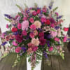 A beautifully crafted arrangement of fresh flowers for the top of a