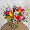 A wide clear glass cylinder filled with a lot of color and