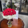 A classic red rose and baby&#039;s breath bouquet is a romantic and