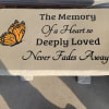 Concrete bench with butterfly engraved. Butterfly color may vary based on availability