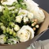 Experience the timeless beauty of our hand-tied white bouquet, lovingly wrapped in
