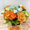A bright color arrangement. This arrangement features bright blue and orange color