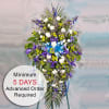 This beautiful standing spray features a stunning combination of blue, purple, and