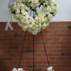 An all white tribute, this heart shaped easel shows your everlasting love.
