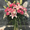 Simple and Tall design arranged with Pink Lilies, one dozen Pink Roseswith