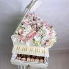 This charming piano arrangement features a delightful combination of white hydrangeas and