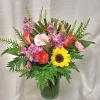 Vibrant and enchanting flower arrangement. Inspired by the warmth of sunshine and