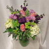 Introducing Lavender Elegance, a beautiful and custom-designed flower arrangement that combines the