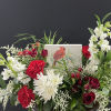 Cardinal Sympathy block surrounded by flowers.  A beautiful arrangement to send